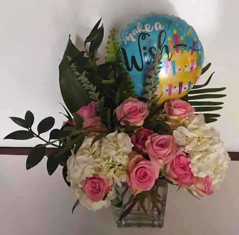 A flower arrangement for to make a wish celebration. Pink, white, and green floral bouquet for Boston delivery.