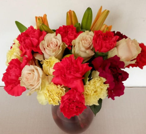 A beautiful arrangement of fresh-cut flowers for any gifting occasion. This arrangement is available at KJ Paula Gift Baskets in Boston, Massachusetts, for same-day delivery if ordered before 9:30 am.