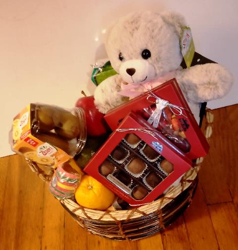 Boston's finest chocolate gift basket with a teddy bear is available for delivery by KJ Paula for any occasion to the recipient's location.