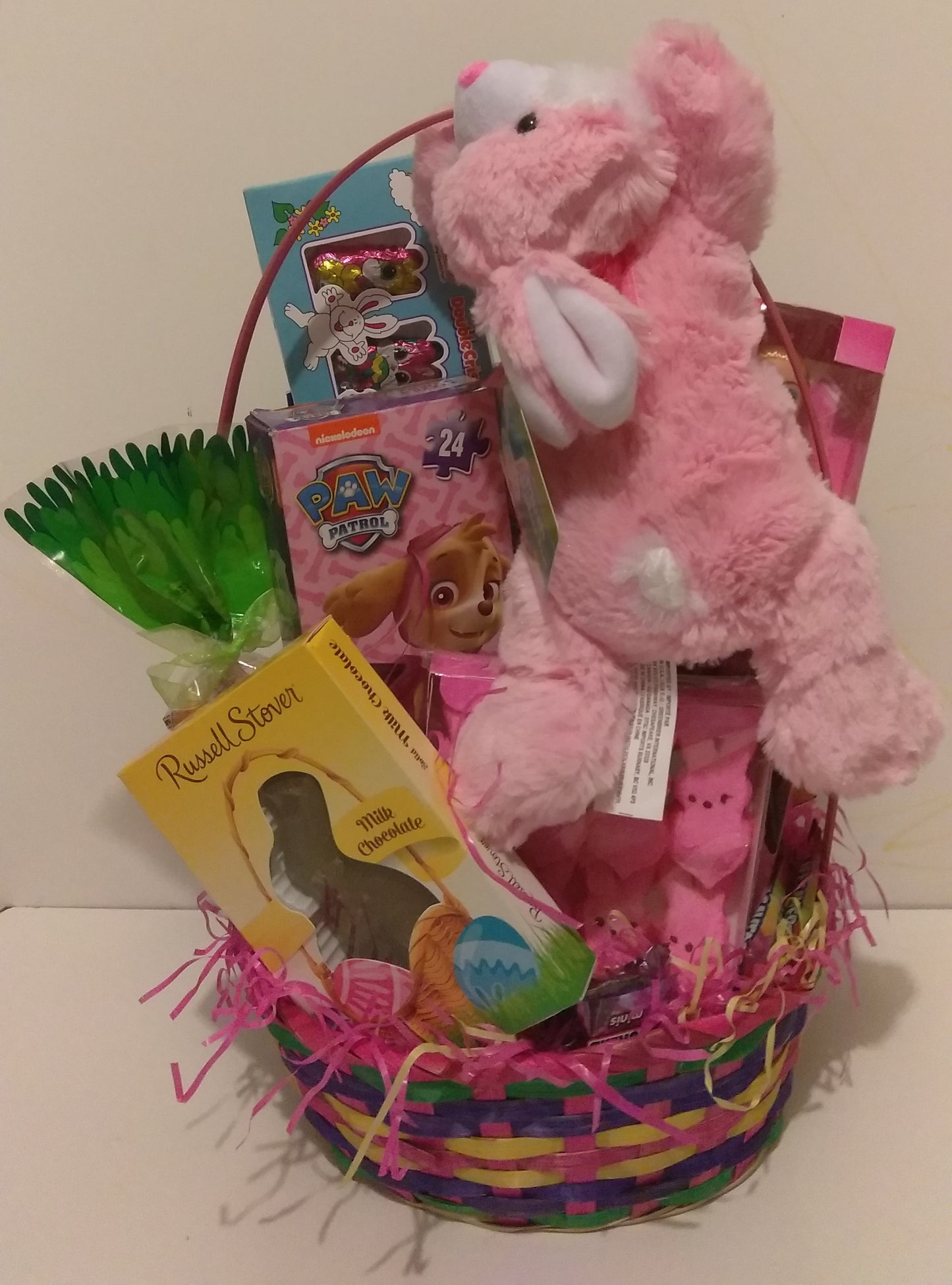 Adorable Easter Gift Basket for little girls in Boston MA. Chocolates, and Easter bunny games. Easter basket available at KJ Paula