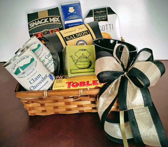 Basket filled with Clam Chowder, Smoked Salmon, Snack Mix and Biscotti Cookies