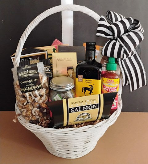 A basket filled with gourmet food, available at KJ Paula Gift Baskets for delivery in Boston, MA., a corporate gifting gift basket.