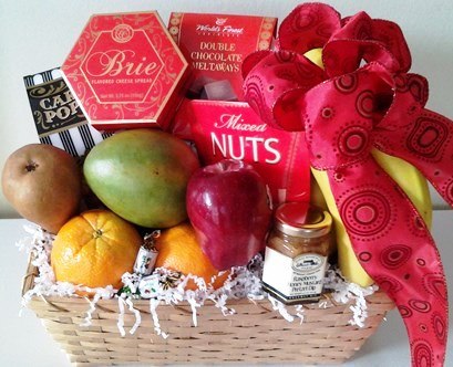 A basket packed with ripe bananas, mango, and, nuts for same-day delivery in Boston, Dorchester, and Canton, Massachusetts.
