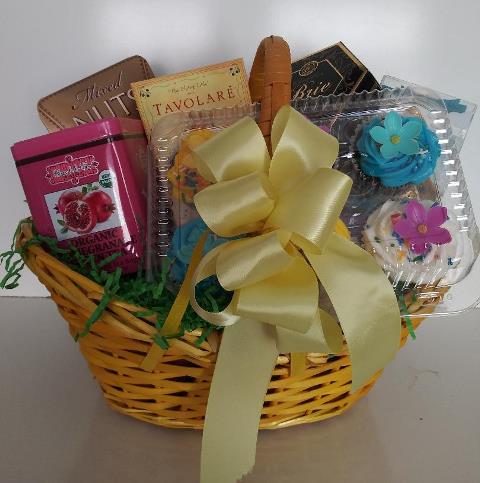 This gift basket is filled with sweet treats, snack mixes, chocolate, and nut treats for easter gifts.