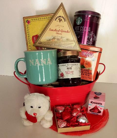 Coffee gift basket with mug, pack of ground coffee, cheese, snacks, and chocolate at KJ Paula Gift for delivery in Boston.