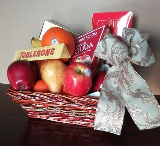 A basket filled with fruit, chocolate, cheese, crackers, nuts, and cookies, is available for delivery to the recipient location.