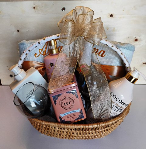 Spa bath and body personalized towels,  sparkling cider, organic tea, body lotion, body wash.