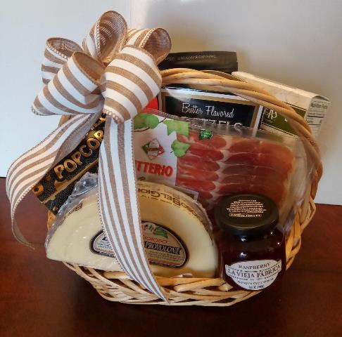 A wicker basket filled with dried smoked meat, savroy cheese, snack mixed in boston, ma call 617-990-7814 for delivery