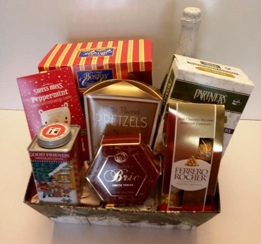 A gift basket of gourmet snacks for the Christmas Gifting Season 2025. Fresh-baked coffee cake, chocolate, and hot cocoa mix.