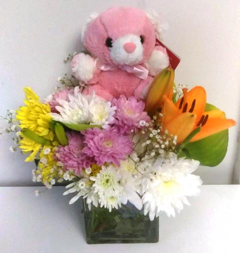 A baby gift basket flower and teddy bear
