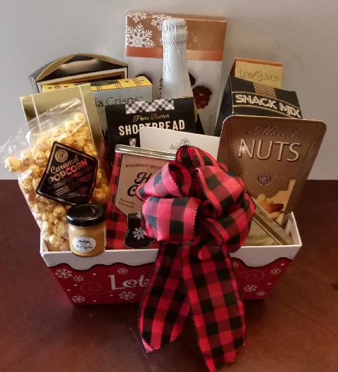 Holiday food gift baskets filled with chocolate, caramel popcorn, hot chocolate mix, shortbread cookies, nuts, and crackers