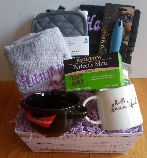 Housewarming gift basket, packed with useful items for kitchen use.