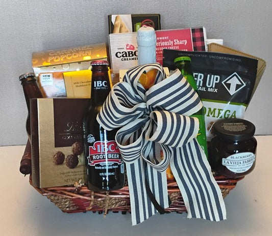 A corporate gift basket with chocolates, trail mix snack, crackers, cheese and bread stick snack. Boston delivery 617-990-7814