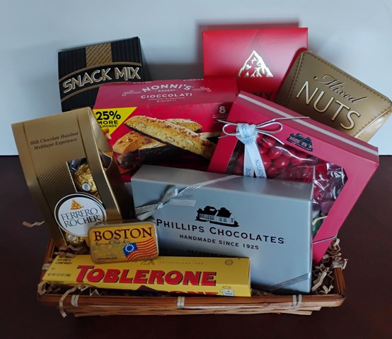 A basket fill with handmade premium Boston chocolate, gourmet snacks, and assortment of delicious chocolates. Boston, MA. Delivery