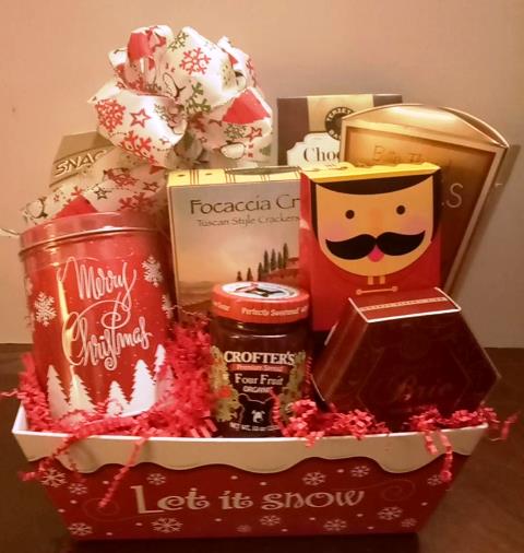  A red and white container filled with holiday cocoa mix, gourmet cookies, and crackers for delivery to Boston zipcode 02199 to Wellesley 02481