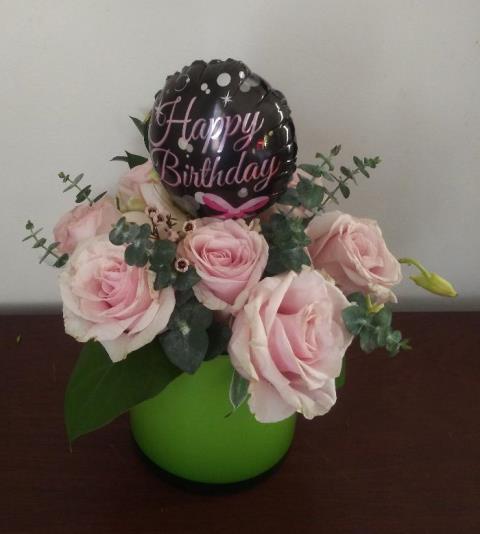 A beautiful roses arrangement with a birthday balloon attach, for a happy birthday wish. 