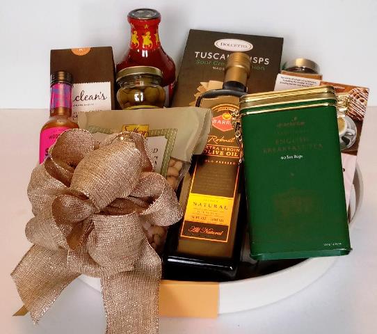 A Christmas gift with olive oil and tea. At KJ Paula Gift Baskets in Boston, MA., for the holiday gifting season. Delivery is available. 