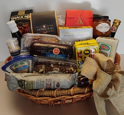 Gourmet food gift basket with cheese, crackers, nuts, and chocolates, finished with a large gold bow