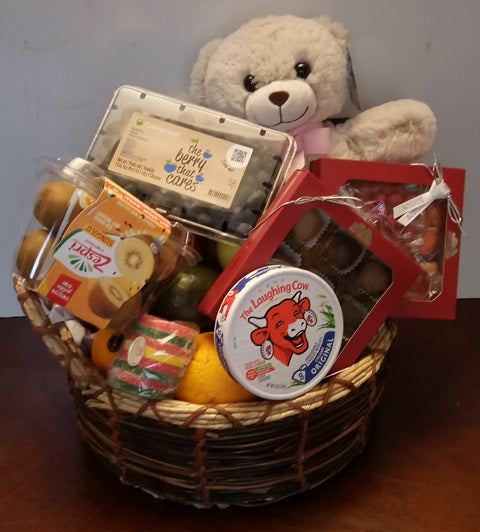 A basket filled with fresh fruits for get-well-and the delivery comes with a teddy bear. This gift is available at KJ Paula Gift