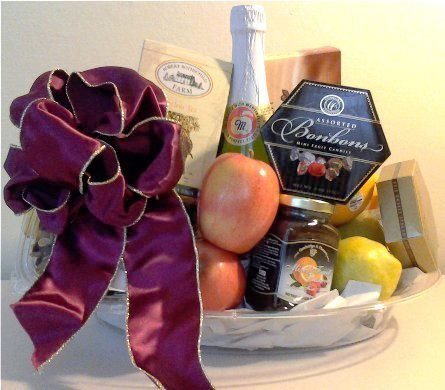 A get-well gift basket for Boston, Massachusetts delivery, packed with chocolate, candy, mixed nuts, and fresh fruits. 