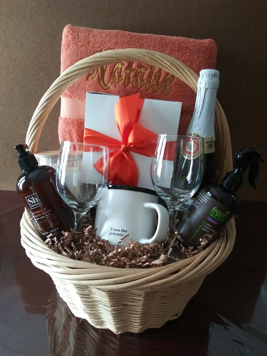 A basket with a personalized towel for a birthday or anniversary present. Boston delivery or shipping is available at KJ Paula Gift.