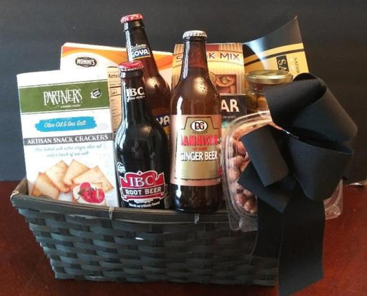 A gift basket filled with gourmet food for men. Smoked salmon, cashew nuts, and snack mix. For Boston delivery.