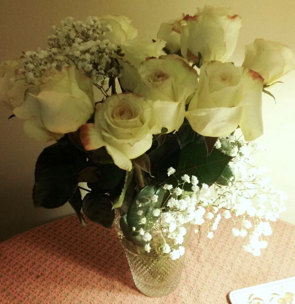 Freshly cut white roses are available for delivery at KJ Paula Gift Shop in Boston, MA. Contact 617-990-7814 to order.