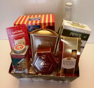 this gift baskets is packed with a variety of Christmas goodies. It has cracker and cheese, hot cocoa mix, single wrap chocolates candies,  a box of pretzel and Boston oldie favority coffee cake for you and your to enjoy 