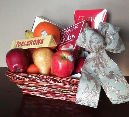 Fruit and Chocolate Gift Basket. This fruit and cheese gift basket is packed with a vast selection of fruit and cheese, crackers, nuts, cookies, and a selection of gourmet snacks.