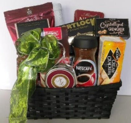 A basket filled with Coffees, gourmet  food and snacks, cookies, crackers, cheese, and dried mixed nuts