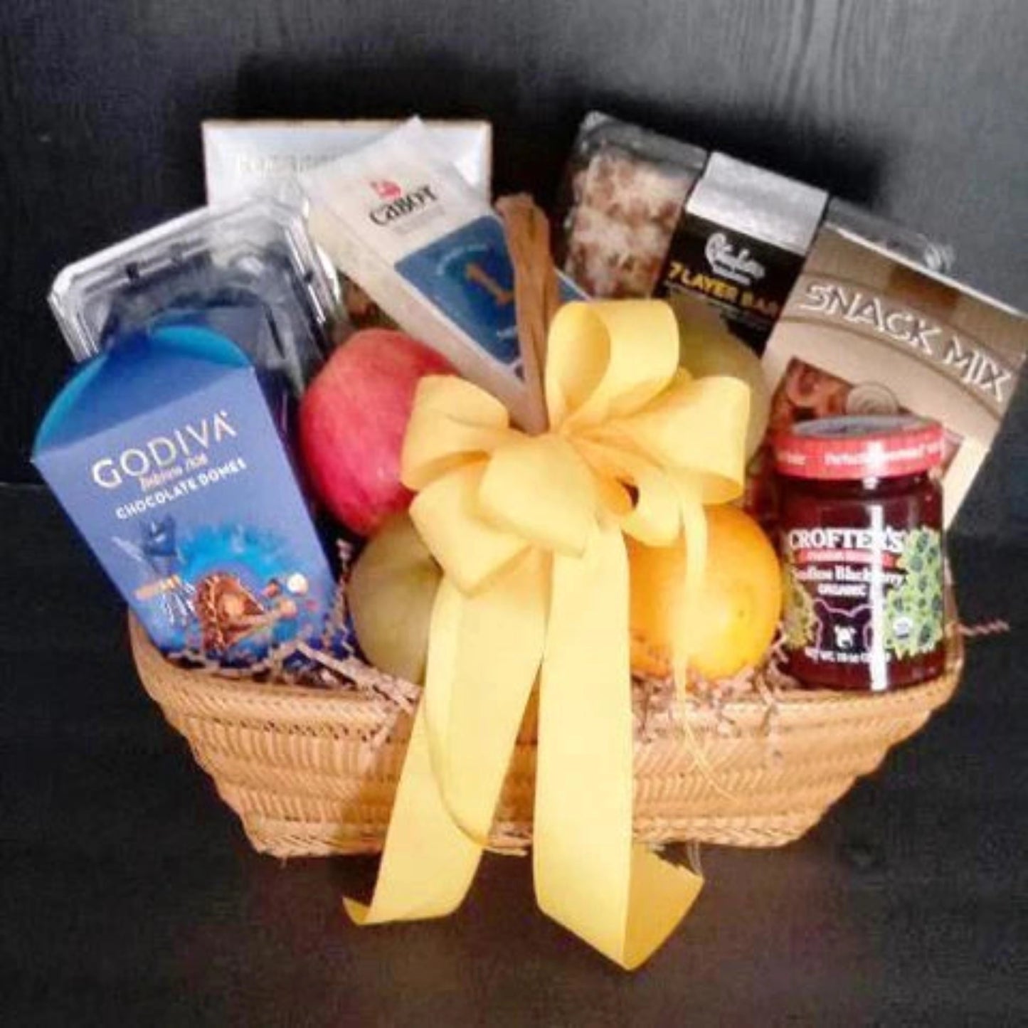 Fruit and snacks gift basket, gift this fruit gift basket to show thanks and appreciation. Fruits, Cheese, Chocolate Crackers and a varieties of snacks are the contents of the gift basket
