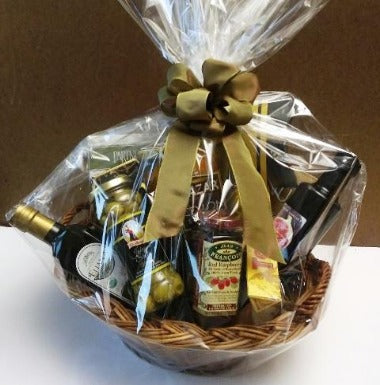 The ideal kitchen gift basket for your ideal gifting for any occasion. Packed in this basket are: smoked salmon, cracker, cheese, virgin olive oil, herbal tea, olives, fruit preserve spread, and a box of fine chocolates.