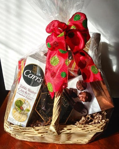 This gift basket is packed with water crackers, gourmet cream cheese, and chocolate.