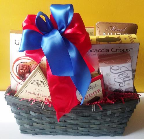 A basket filled with a delightful collection of milk and dark chocolate at KJ Paula Gift Baskets in Boston, Massachusetts for delivery