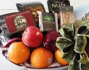 A fruit gift basket with a collection of gourmet snacks, cheese, nuts, crackers, and cookies for corporate offices, and hotel delivery