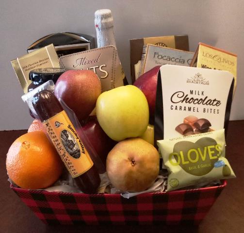 A gift basket filled with beef salami, caramel bites- chocolates, nuts, and snack mix. Available for Boston Hotels, Hospitals, and Business delivery. 