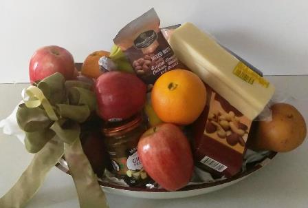 A fruit basket for Brookline and Boston delivery Fruits, Cheese, Nuts, and a jar of fruit preserve. A thank You Gift Idea.