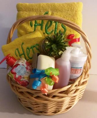 A gift basket filled with personalized towels and bath and body gift items for her. Available at KJ Paula Gift in Boston, MA.