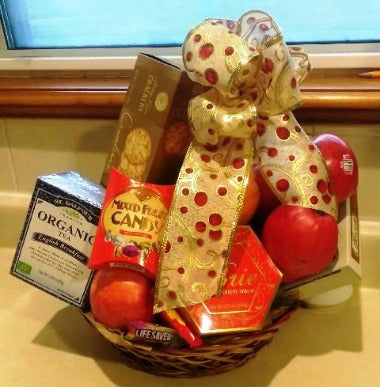 Hospitality delivery fruit basket. This basket includes green tea, crackers, cheese, and fruits. Delivery is available to Boston Hospitals 