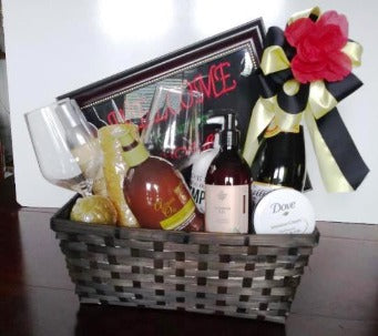 A wicker basket packed with spa bath and body essentials including body wash and sea salt bar soap for Boston, MA. delivery.  