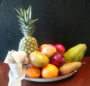 A fruit gift basket with Pineapple, Mango, and Papaya is available in Boston, and Milton, Massachusetts, for delivery. 