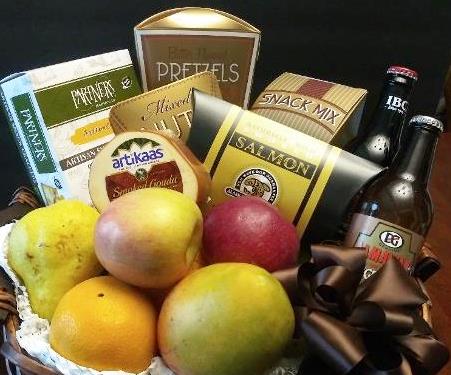 A Jamaica fruit gift basket gift for him idea. Fruits, cheese, cracker, pretzels, snack mix and Jamaica ginger beverage